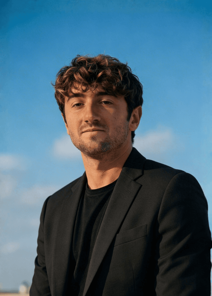Smiling woman in navy blazer.