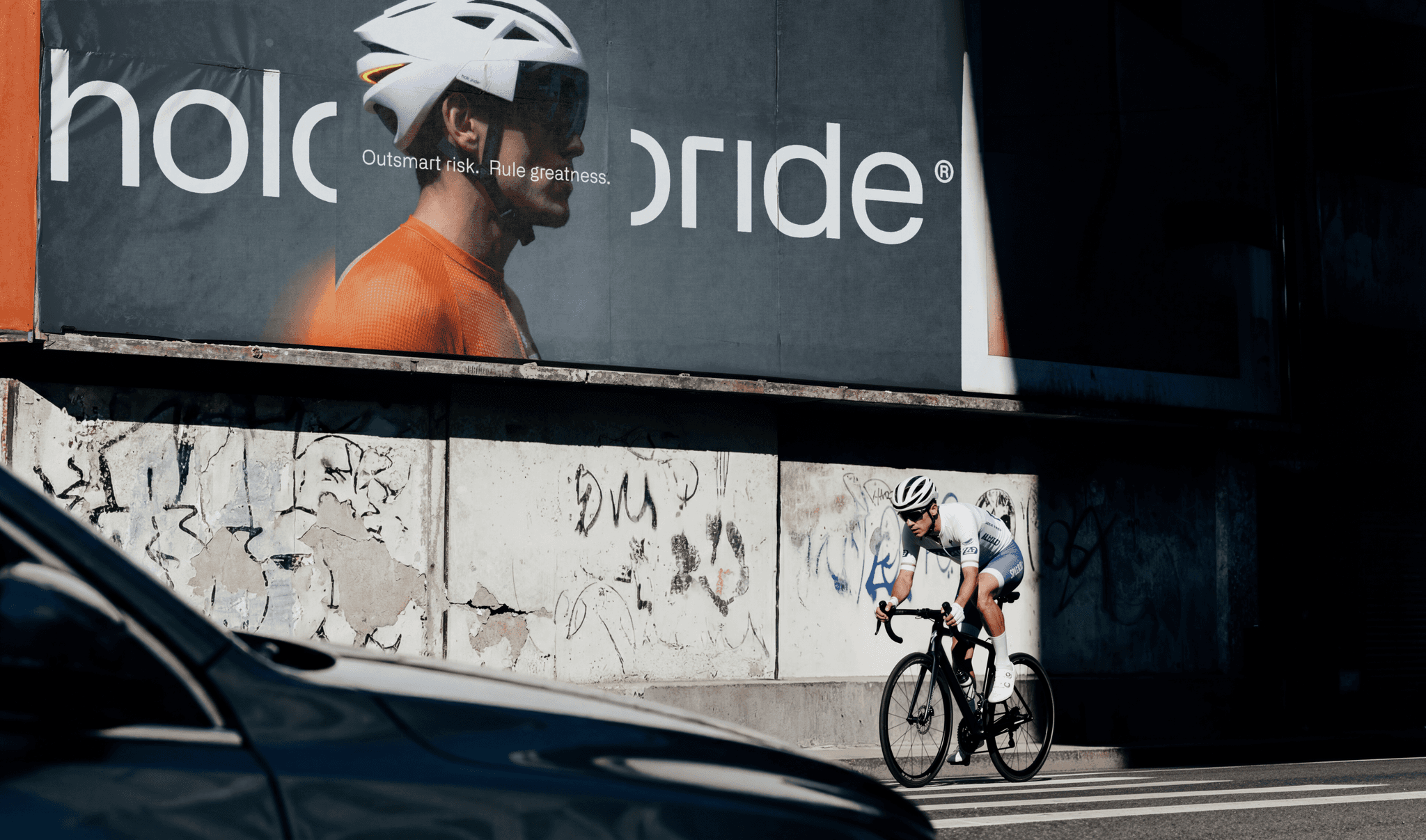 Holoride billboard with a cyclist passing in front