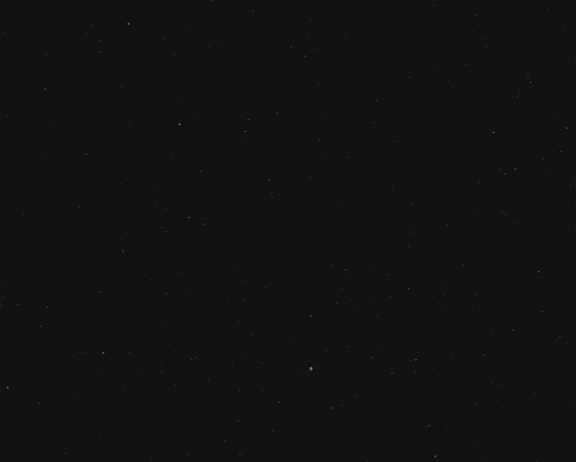 Tree branches reach towards a clear, blue sky.