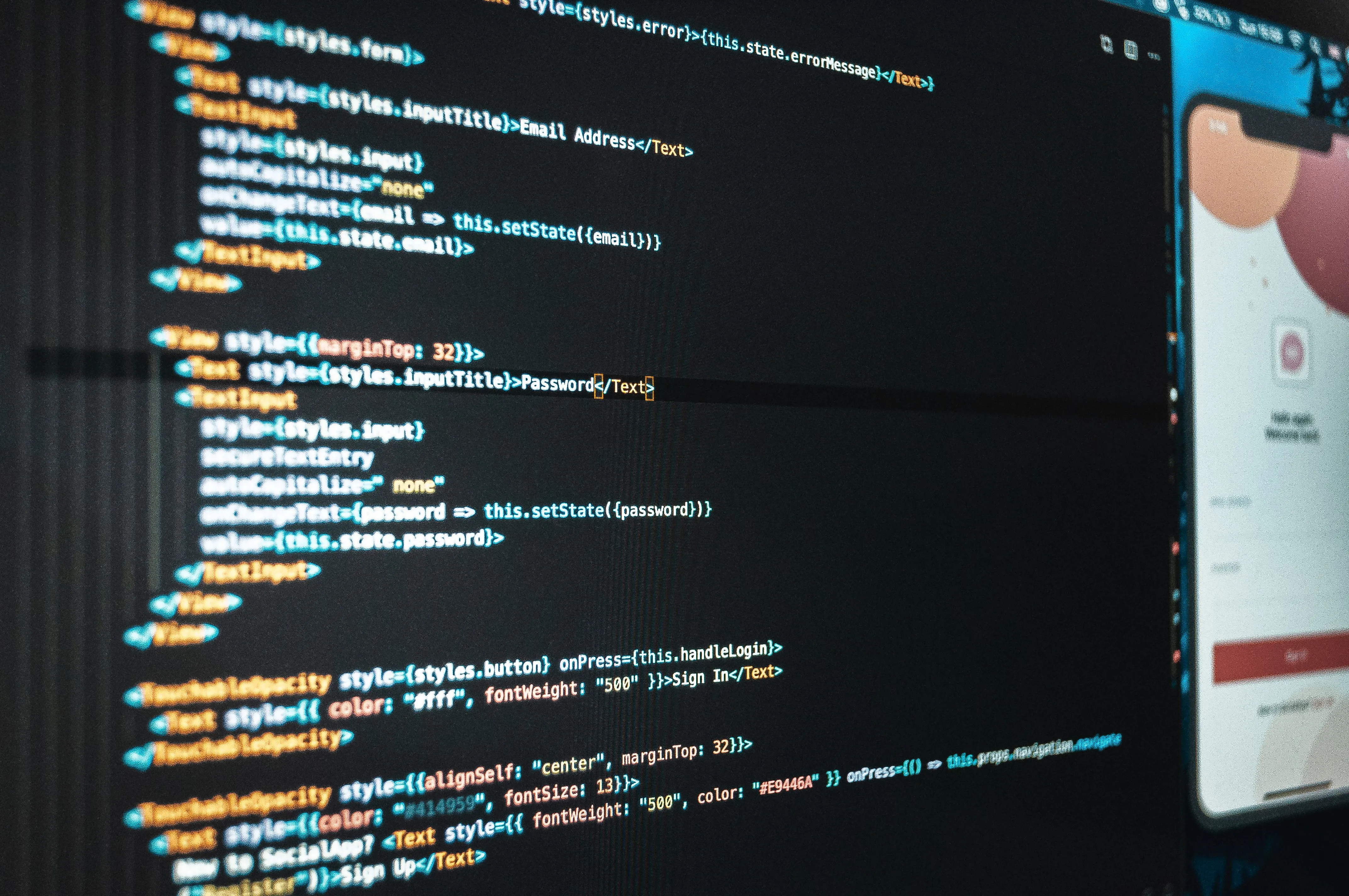 A computer monitor displaying lines of HTML and CSS code next to a mobile app interface mockup with sleek, modern design elements, indicating a web development and design process.