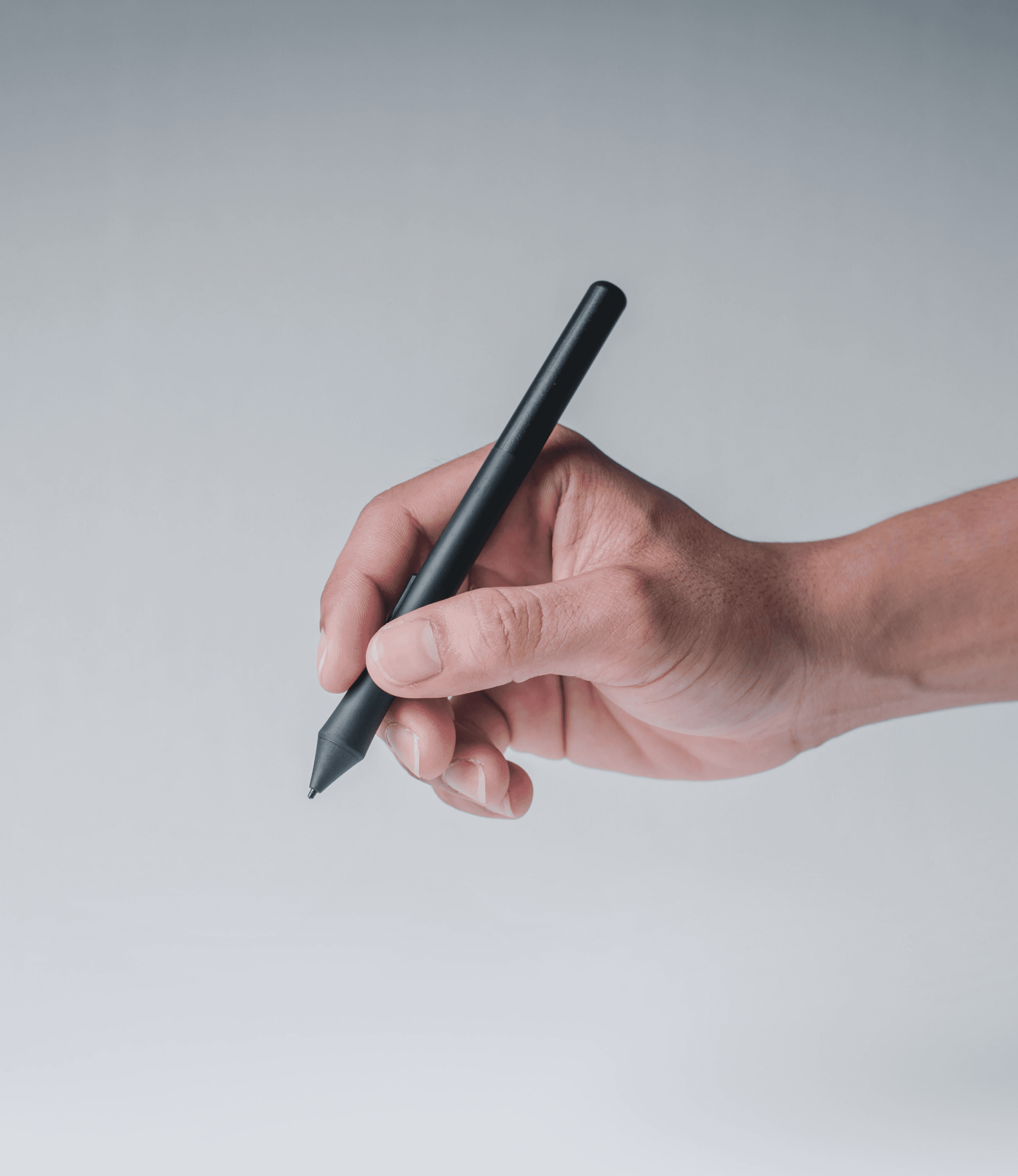 Portrait of a person in dark clothing speaking on a phone