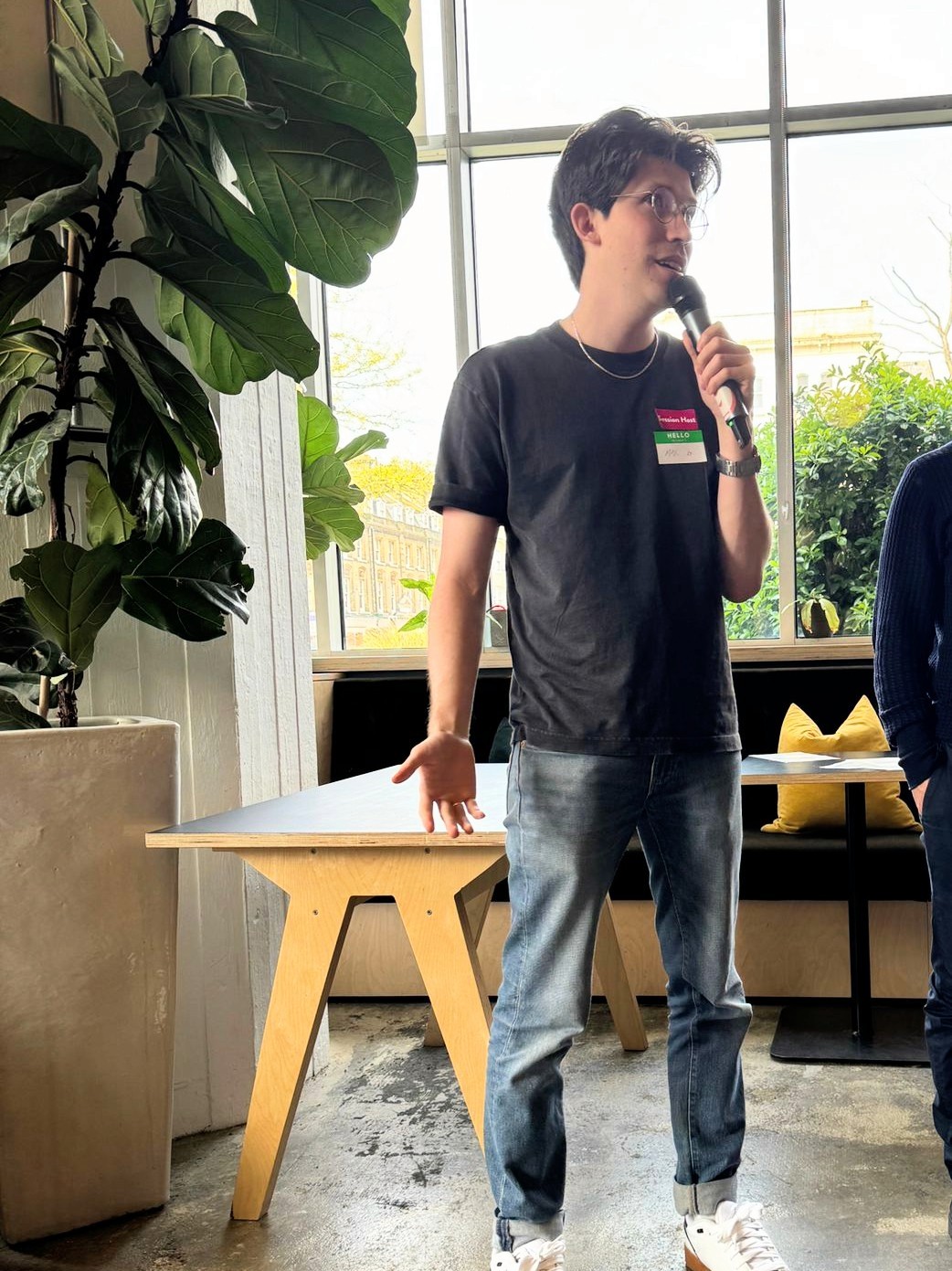 Max Pitching his talk with a Microphone