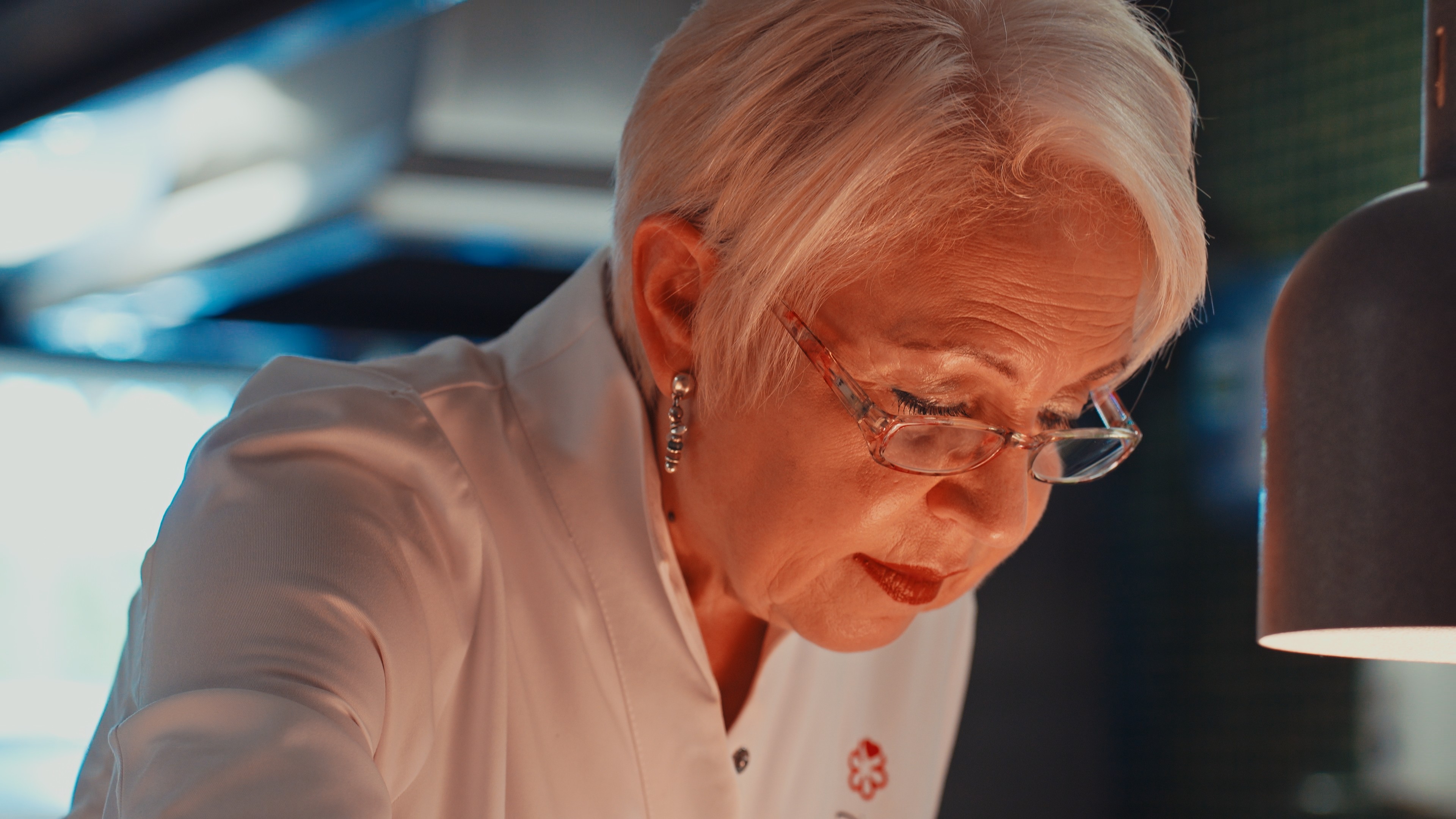 Two men wearing yellow and black face masks, standing side by side, with neutral expressions on their faces.