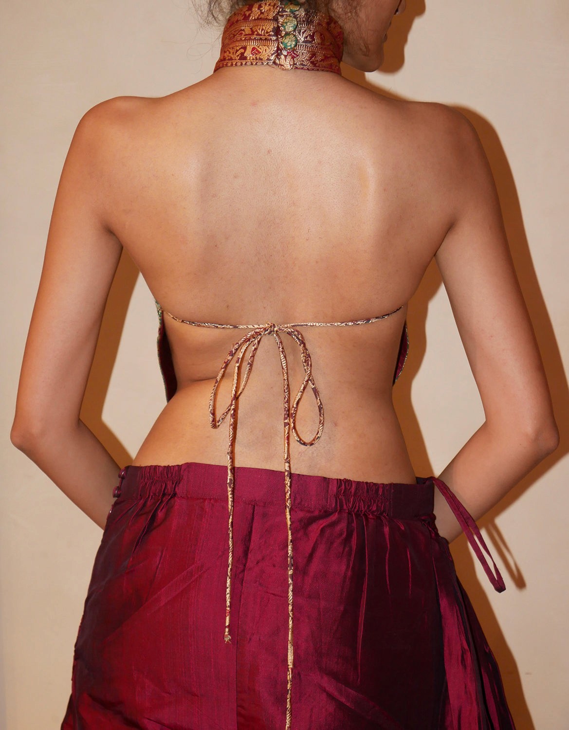 Apsara is our high-neck, backless top crafted from a vintage silk saree, inhouse by skilled artisans.