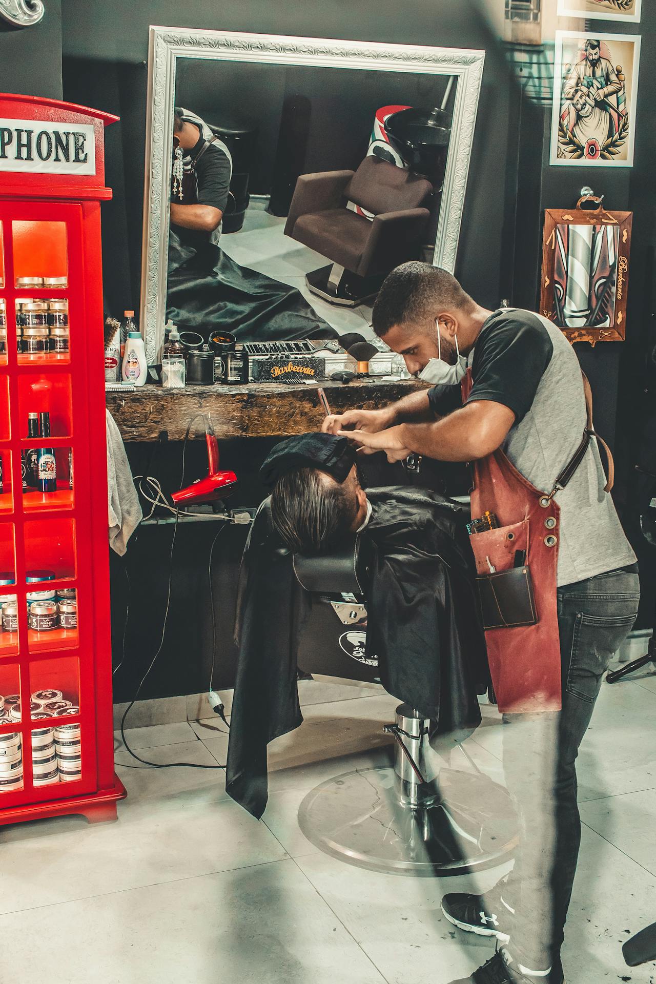 Barber shaving client