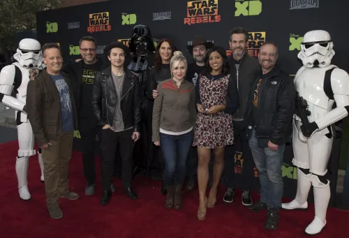 The full Rebels cast with some dressed up stormtroopers standing on a red carpet at a premiere