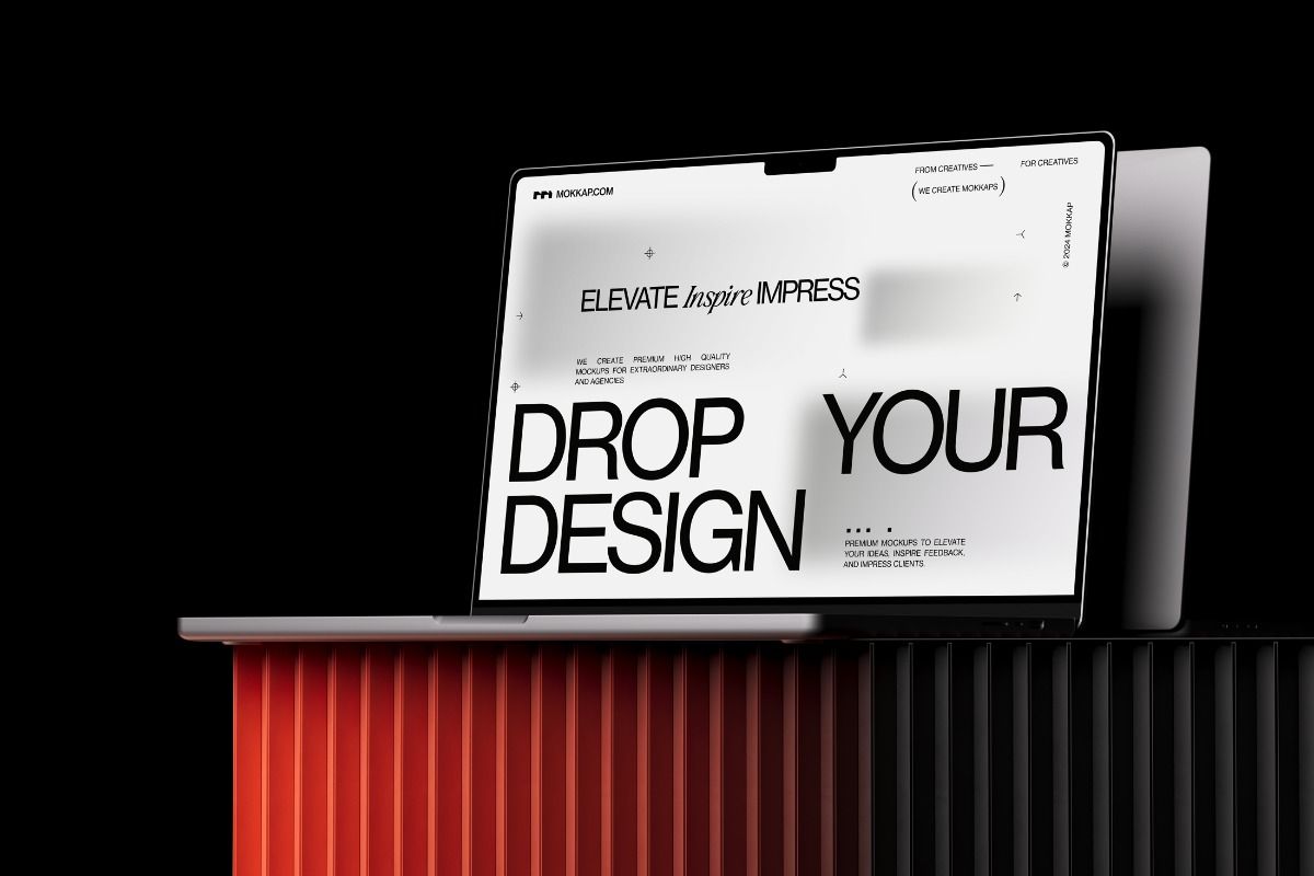 Open laptop showing "DROP YOUR DESIGN" on MOKKAP.COM website.