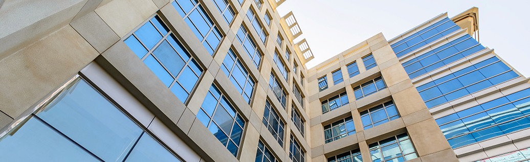 Modern architectural detail of a commercial business center available for corporate real estate investment.