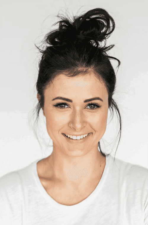 Close-up of a tree stump showing growth rings and a textured brown wood surface.