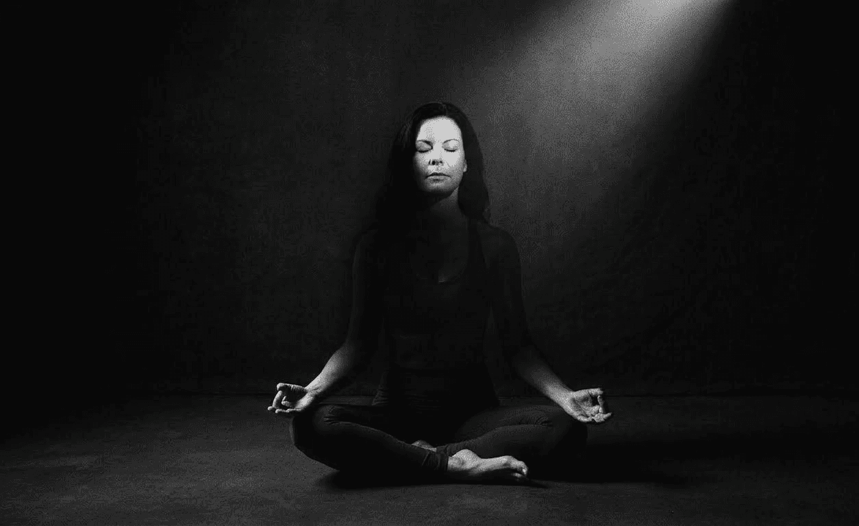 woman seated cross-legged