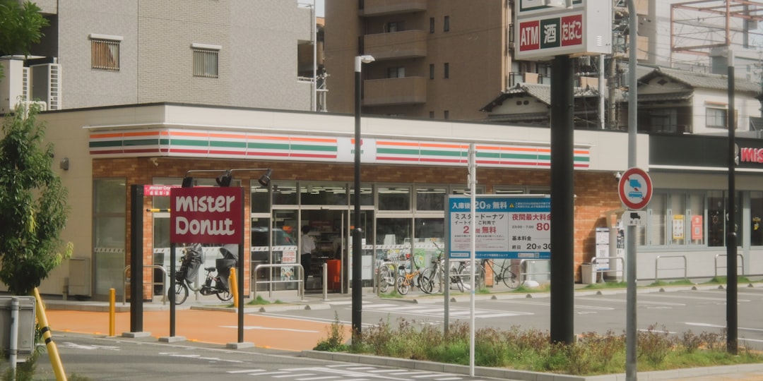 Mister donut store on a street with bicycles.