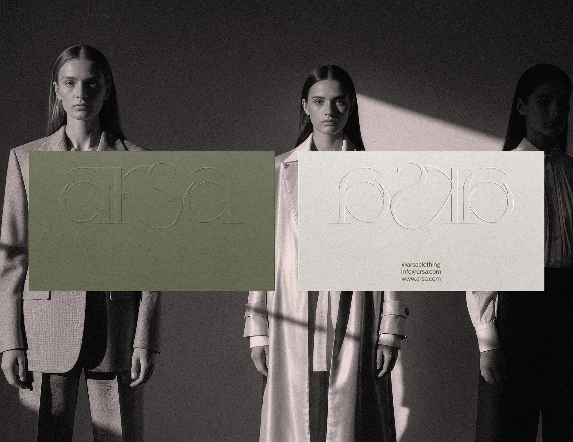 Brand collateral design for Arsa clothing label showing embossed business cards in campaign photography