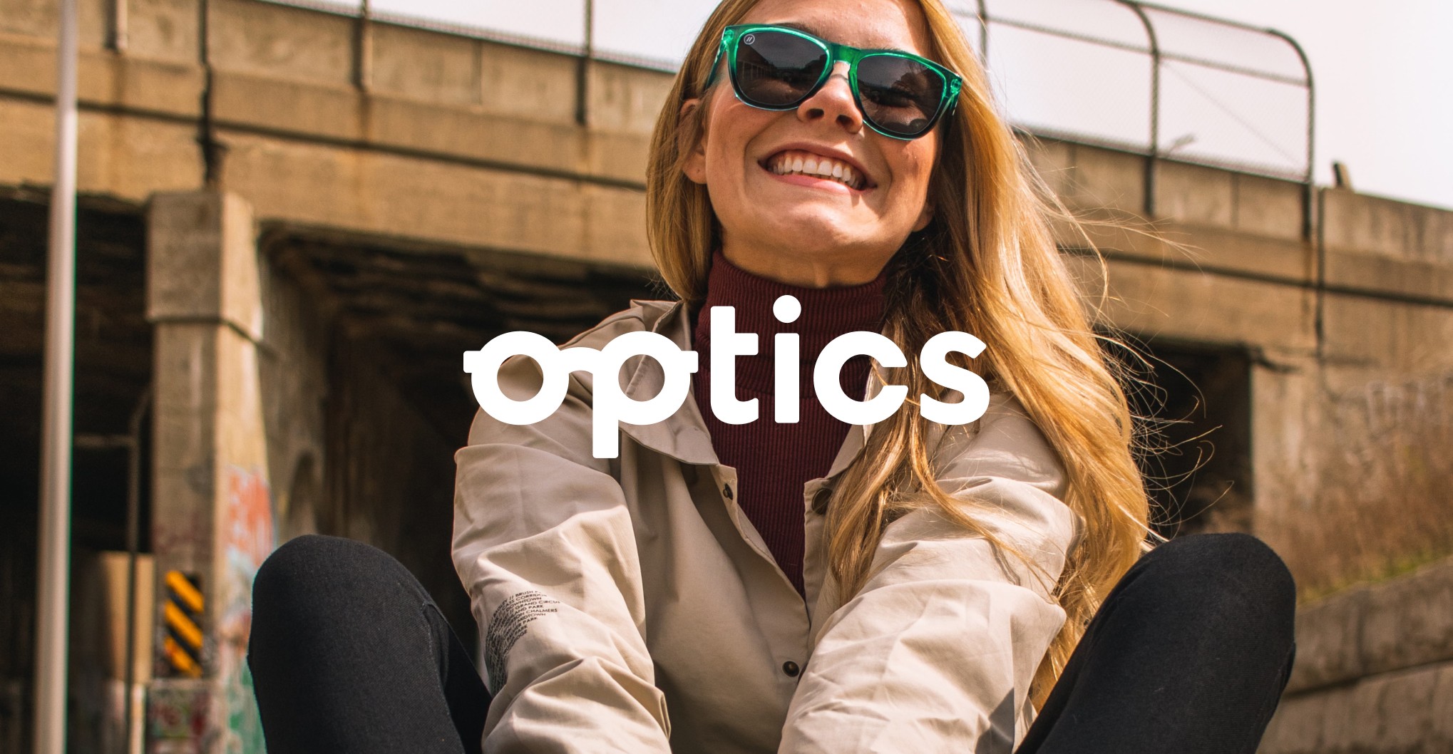 Optics brand photo of girl smiling with sunglasses