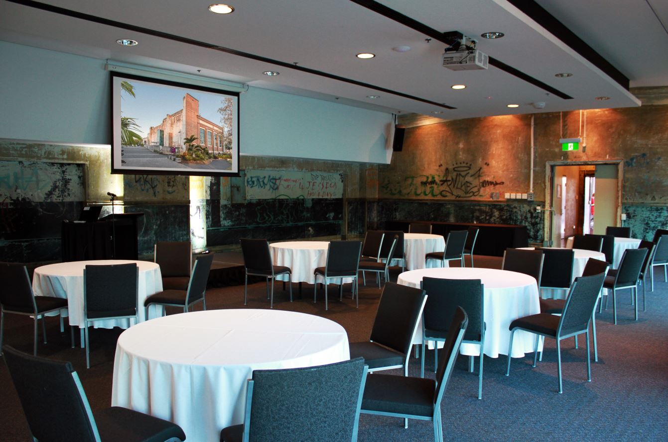 Tables set up for a workshop / conference in the Rooftop Terrace of Brisbane Powerhouse