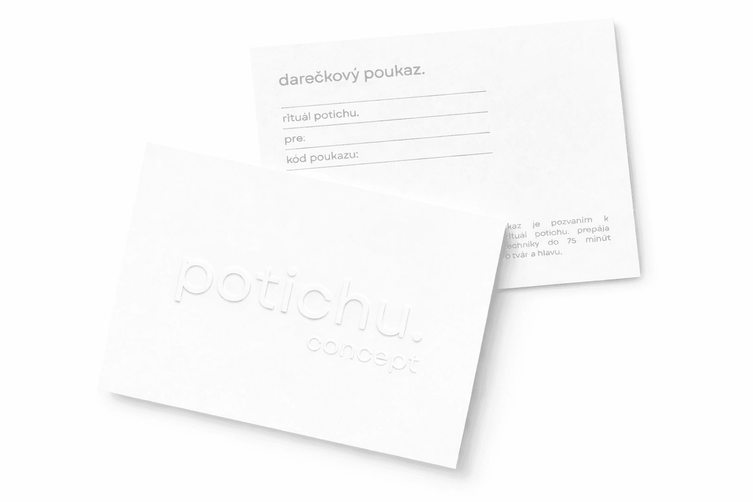 Cozy reading nook with sofa, chair, and plants inside a glass cabin with mountain forest views.