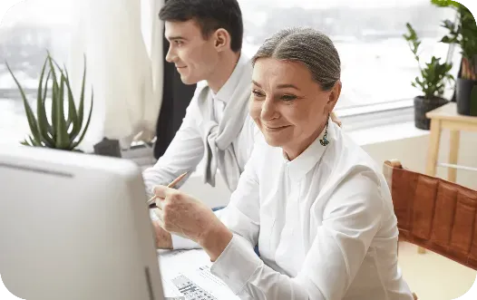 Business professionals managing vendor payments using digital payment software.