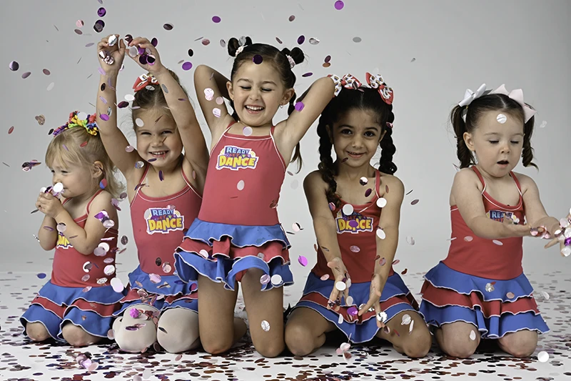 Ready Sey Dance students throwing confetti in the air