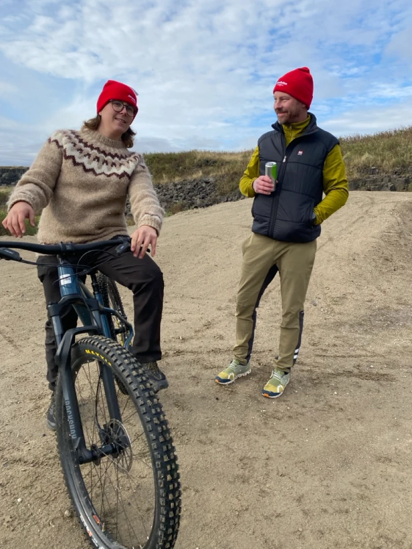 Icebike guides smile at camera one is on a bike