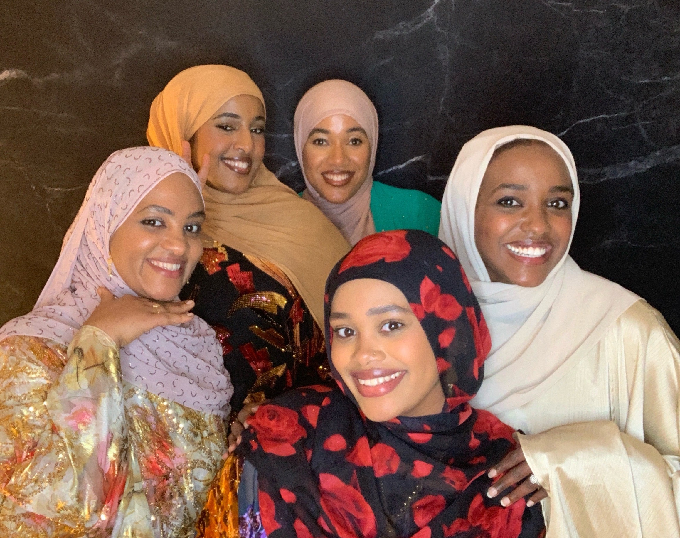 Friends celebrating together at a Layali Booth Co. event in Houston