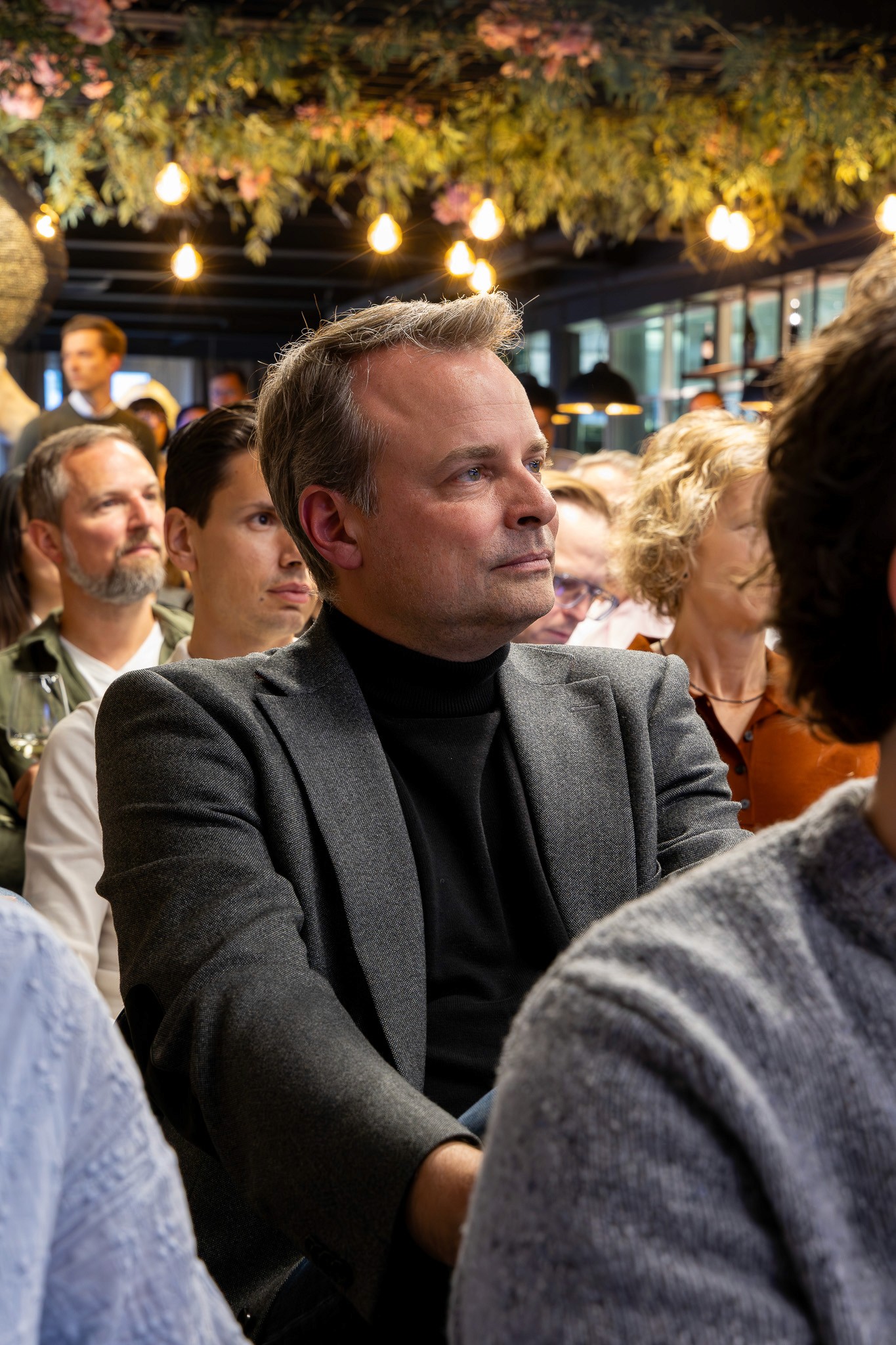 Attendee listening during a blockchain industry presentation.