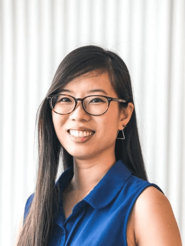 Portrait of a happy client sharing feedback: AIspire automated our processes, saving us hours weekly. It’s intuitive and allowed us to focus on strategic goals.