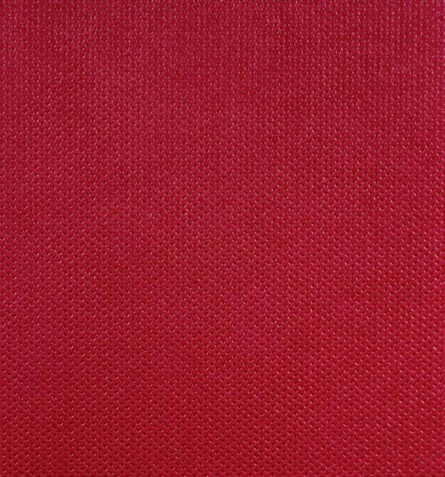 Close-up of textured red synthetic fabric