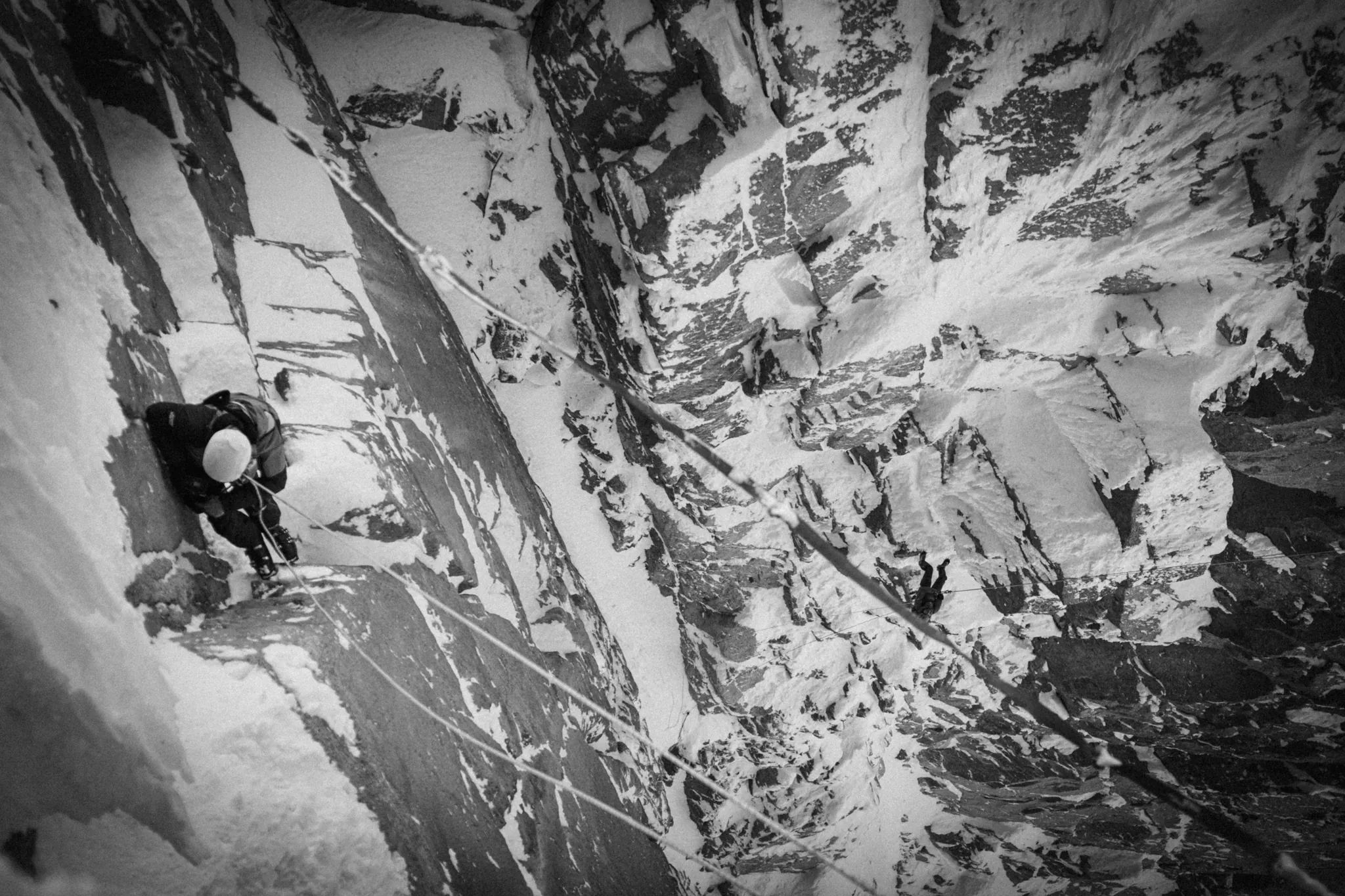 Climber ascending a rock face