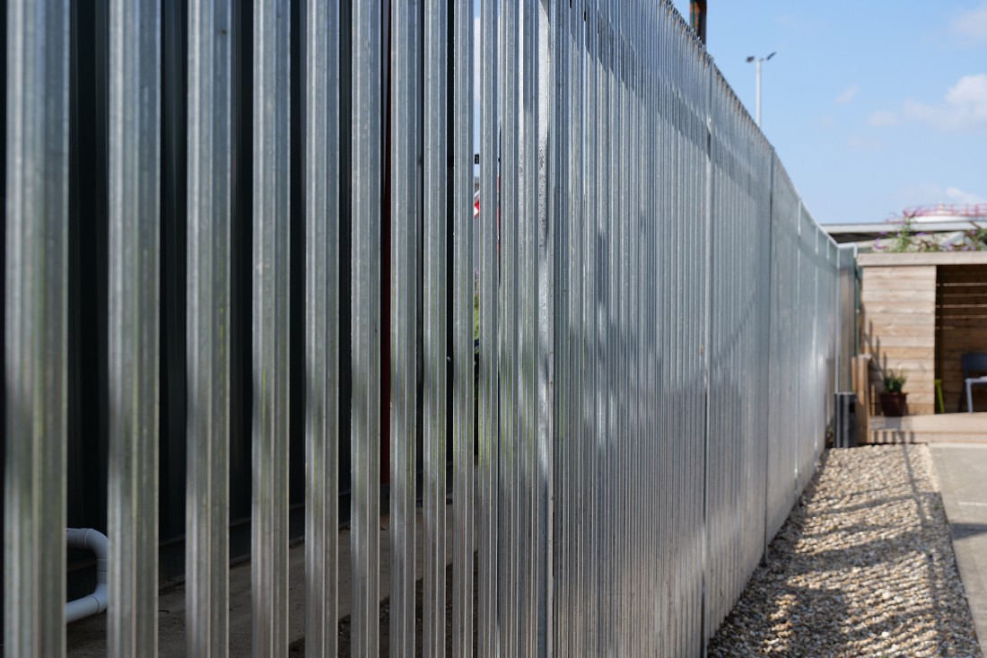 Long Palisade Fence installed and maintained by UK Fencing Ltd