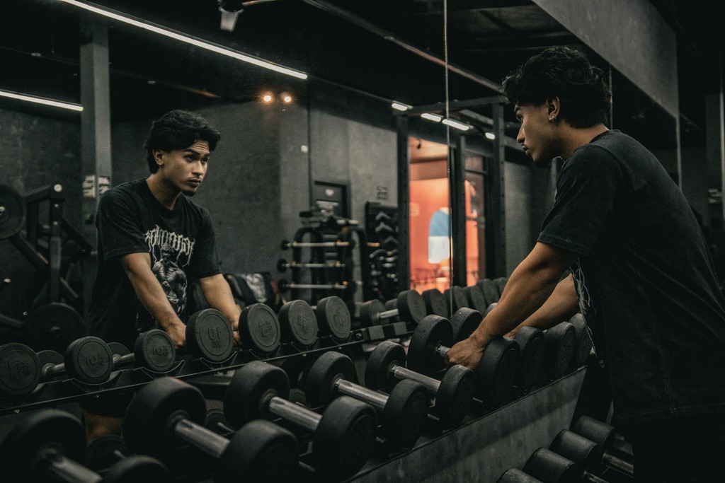A couple of men working out in a gym