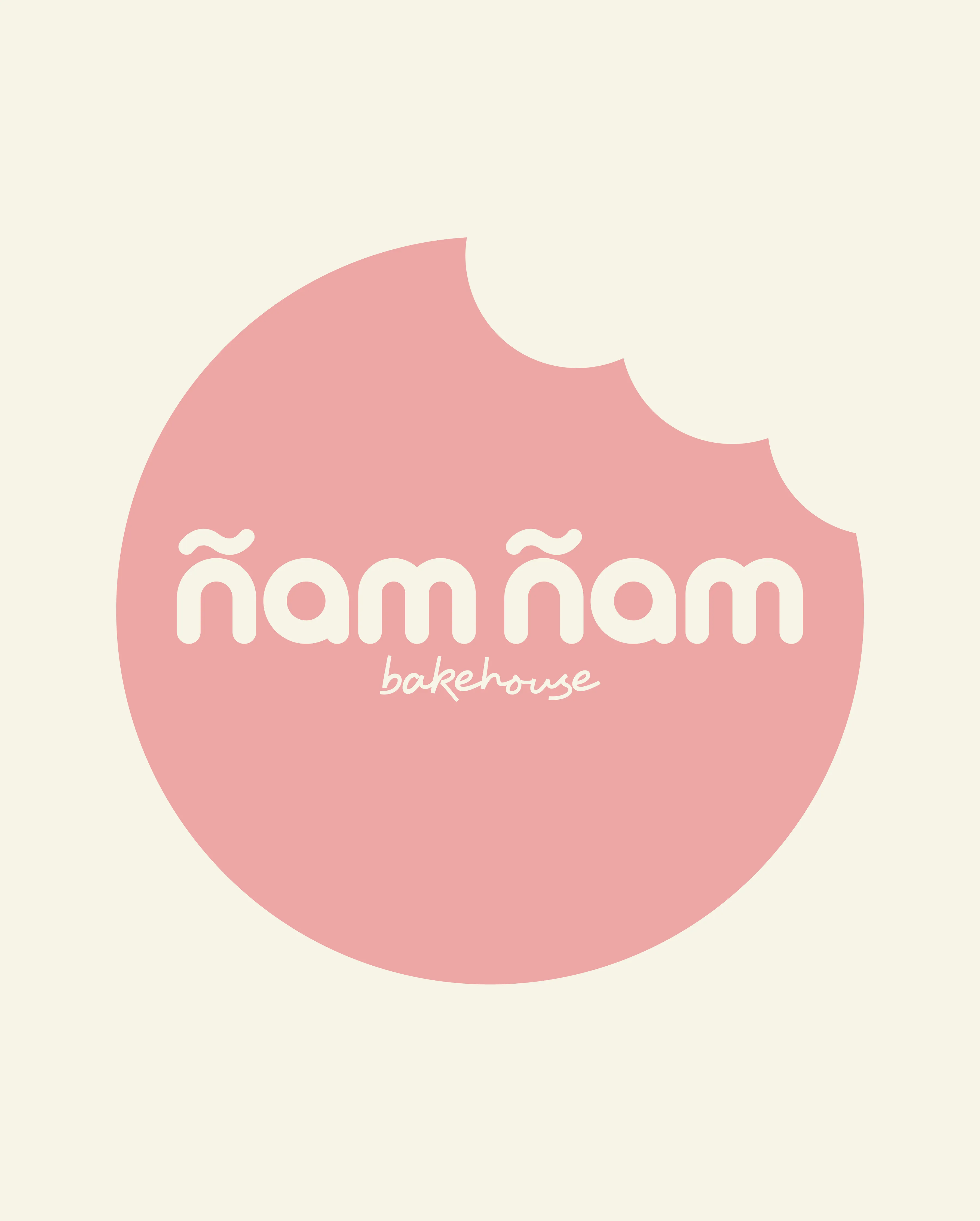 Logotipo de Ñam Ñam Bakehouse en diseño circular rosa
