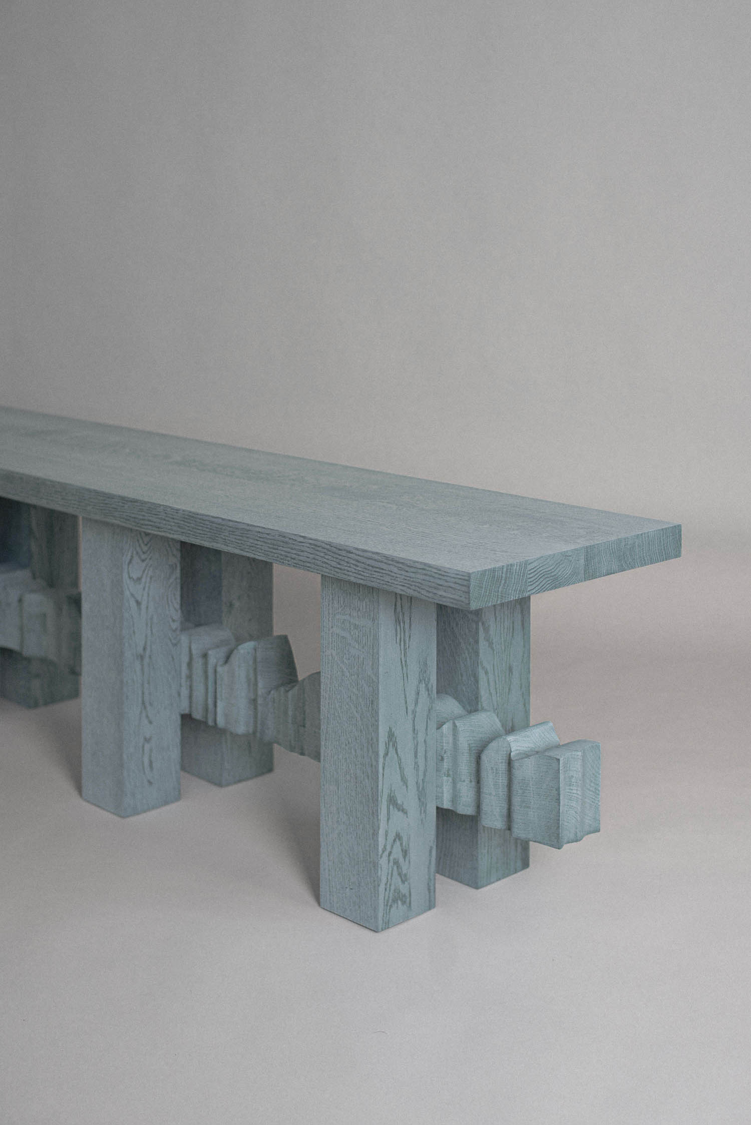 YKB sculptural bench in solid wood with precise joinery and linear proportions by Jiri Krejcirik