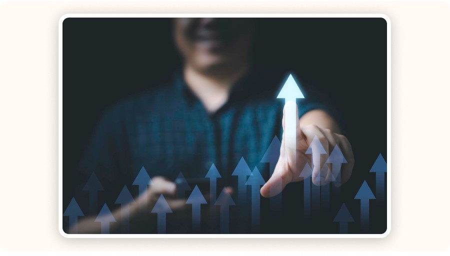Person pointing at rising arrows symbolizing growth, performance, and success&nbsp;