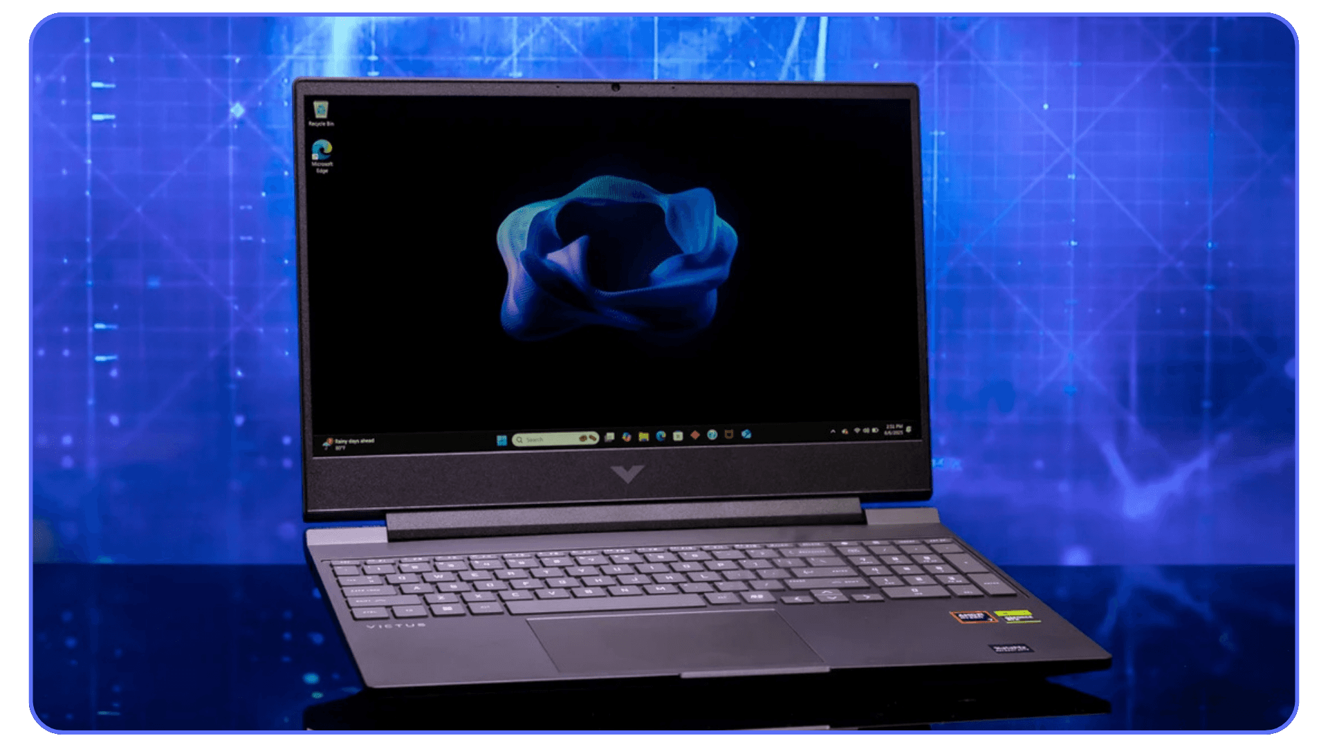 A HP Victus laptop displaying a digital background, with a dark-colored exterior and glowing keyboard, placed on a glossy surface.
