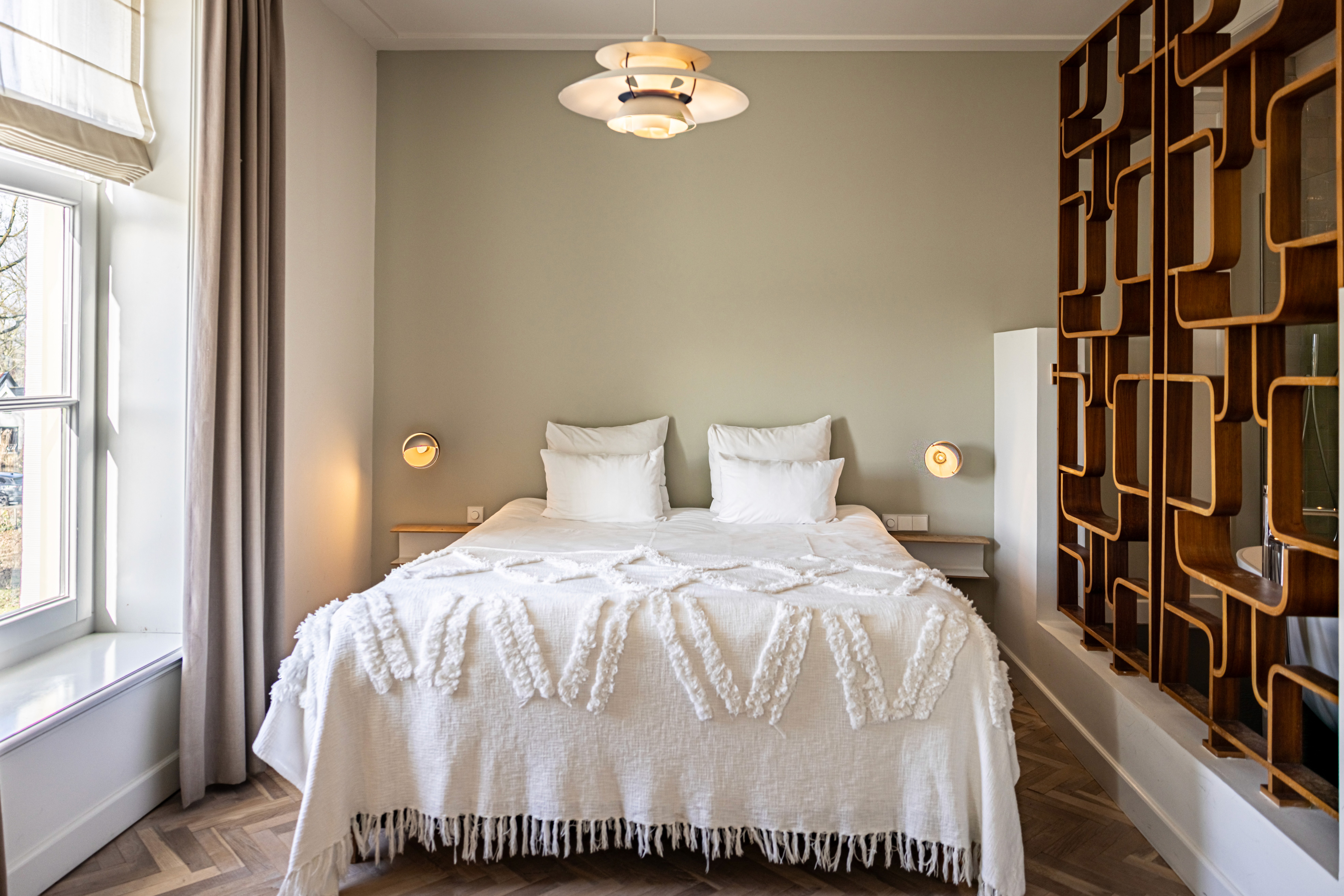lake landscape with clear blue water, forest and mountains at the backdrop