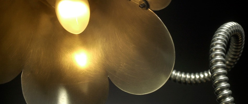 An industrial lamp shade that looks like a flower.