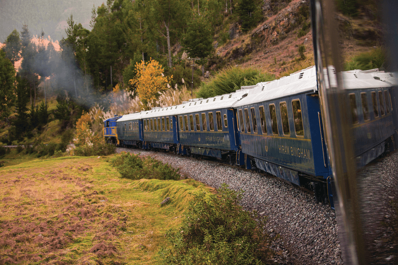 an aerial view of a baseball stadium with a city in the background