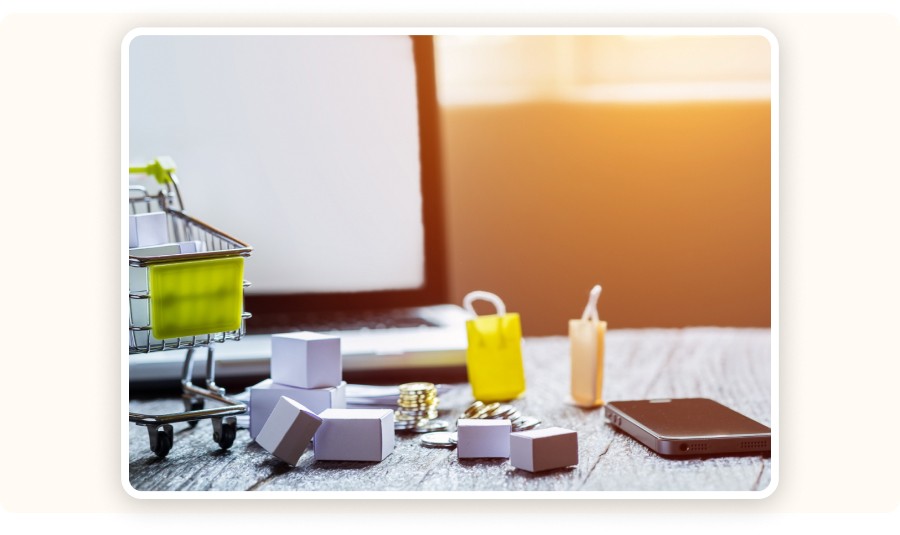 mini cart, small shipping boxes, coins, and a smartphone