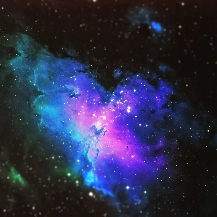 Expansive image of the universe with a nebula.