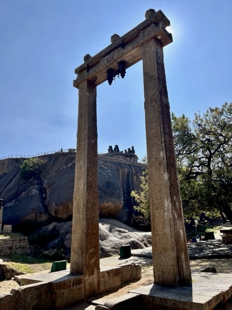 Tula or the weighing scale at Chitradurga. Hidimbeshwara temple is seen in the background. 