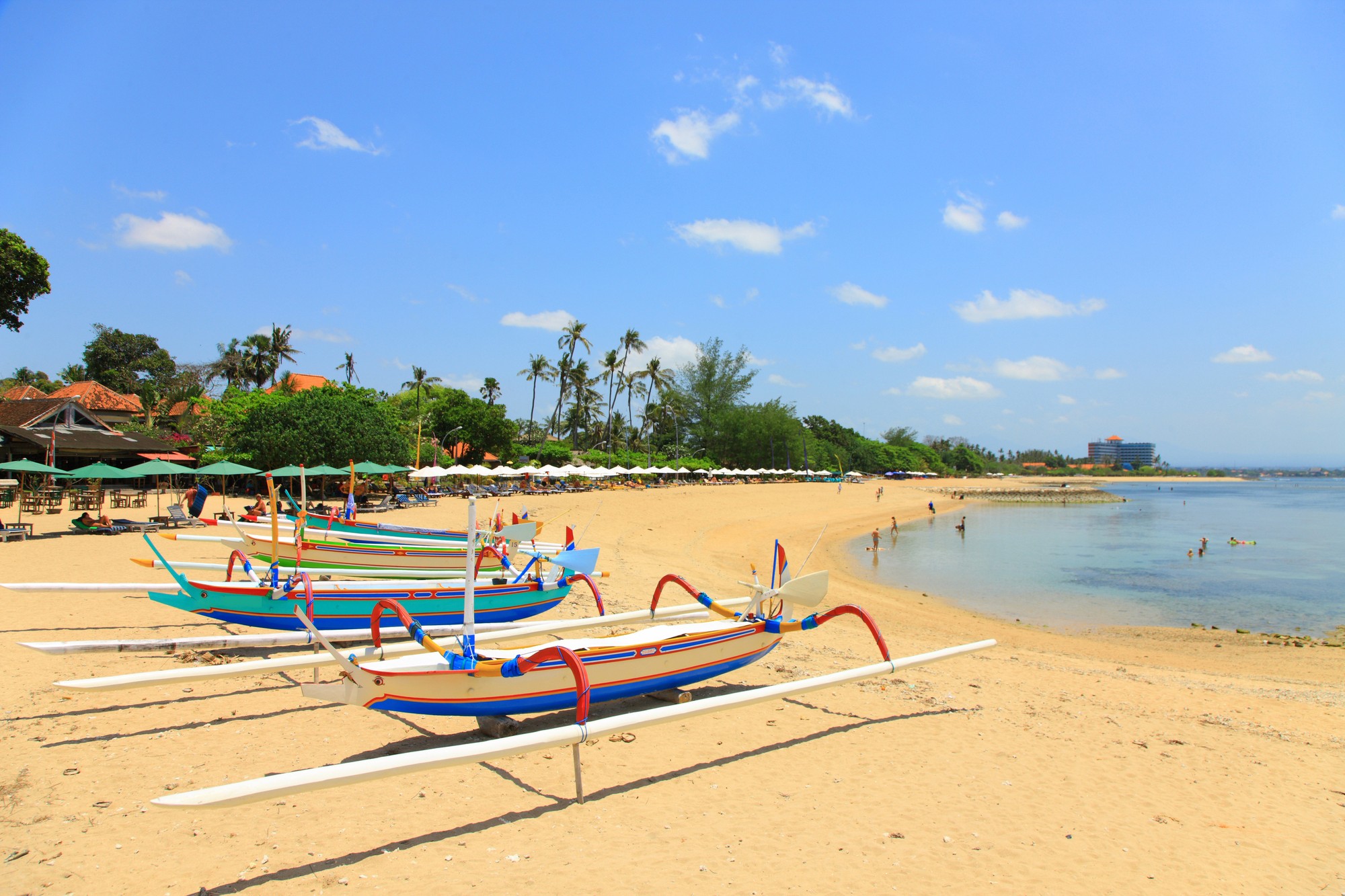 A wooden walkway leading to a body of water