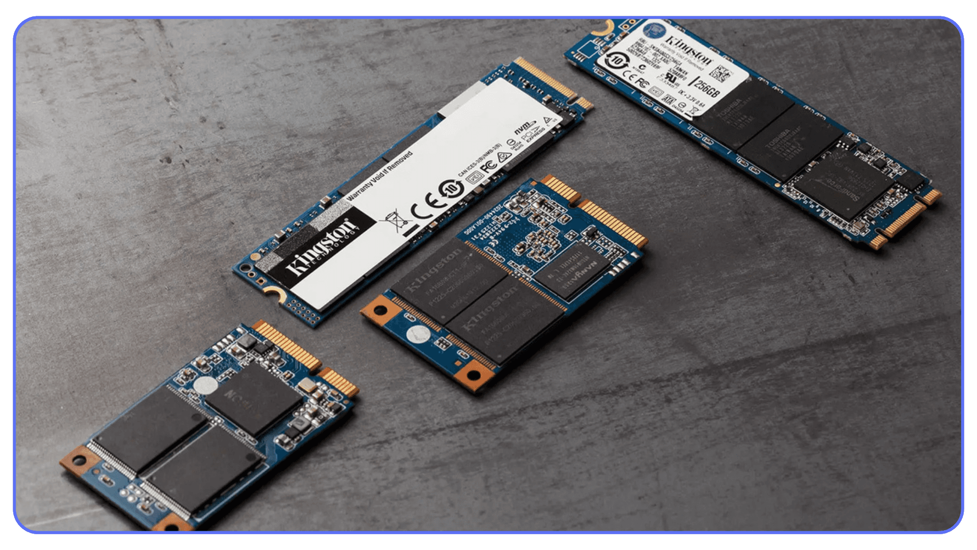 Photo of various SSD models, including M.2 and SATA drives, arranged on a table for comparison.