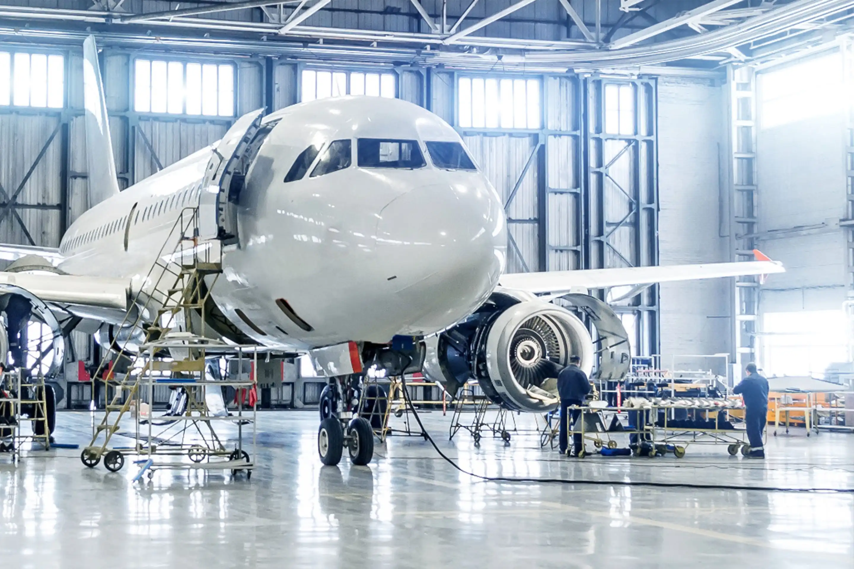 An aircraft in repair within an airport hanger