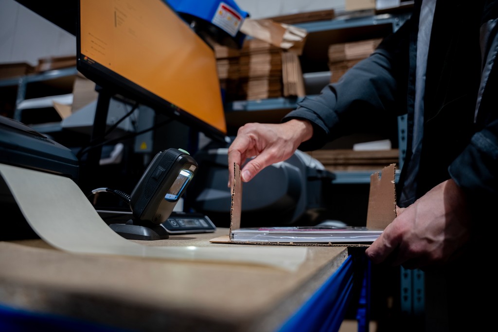 a person holding two water bottles in their hands