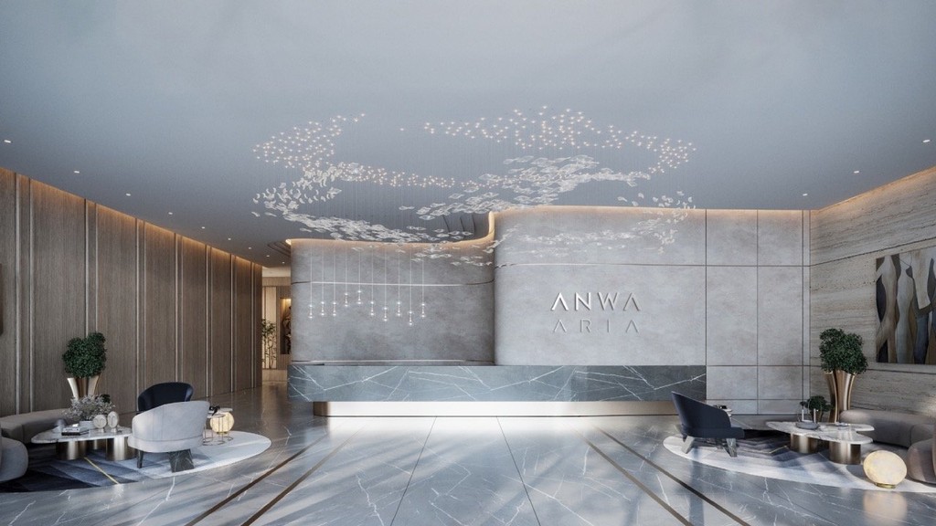 The elegant lobby of Anwa Aria by Omniyat, featuring luxurious furnishings and sophisticated decor.