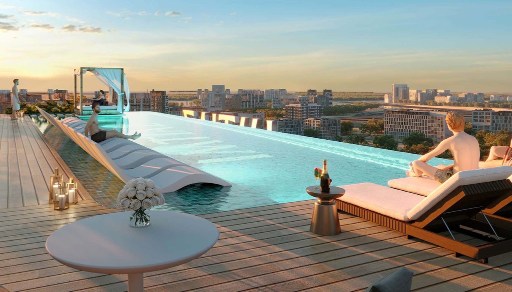 Rooftop pool with lounge chairs overlooking the city skyline at Cove Edition 6.