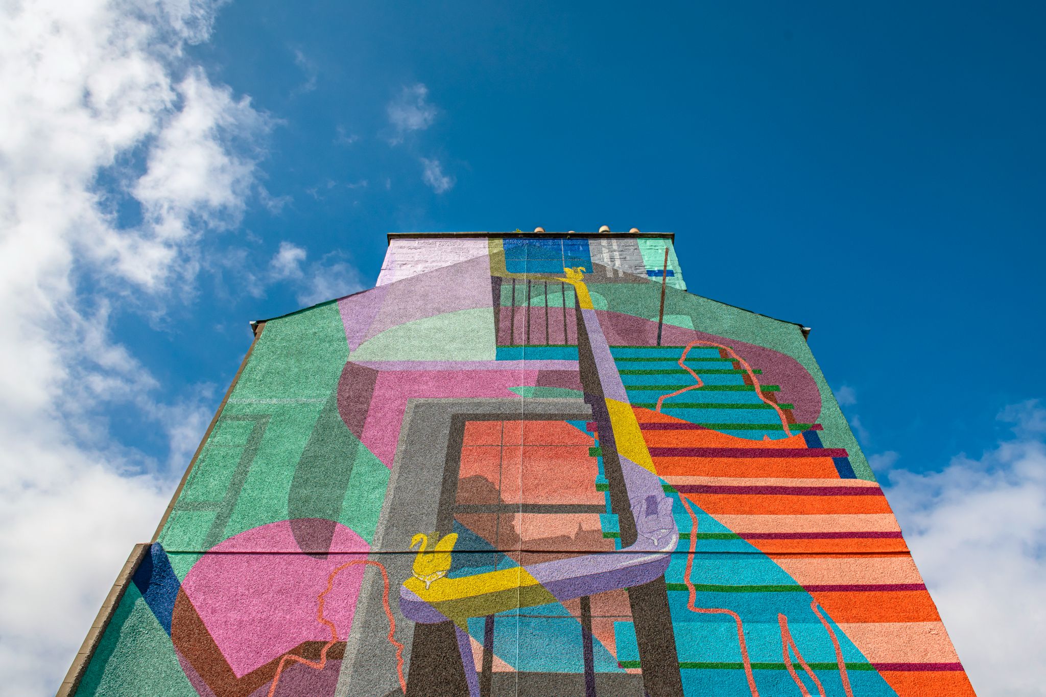 people in a large building with Tate Modern in the background