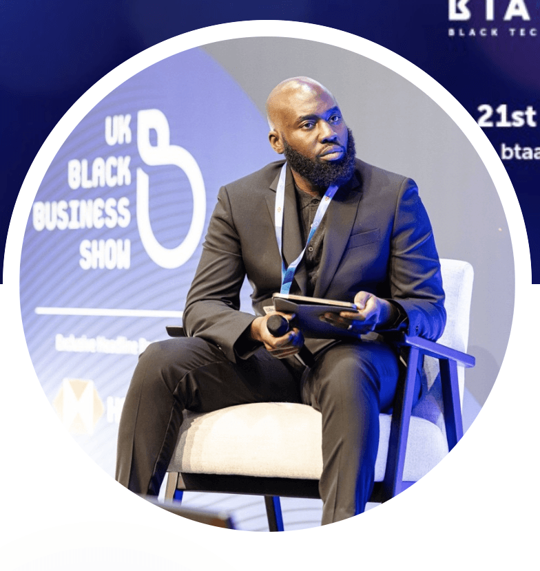 Profile portrait of a man in a white shirt against a light background