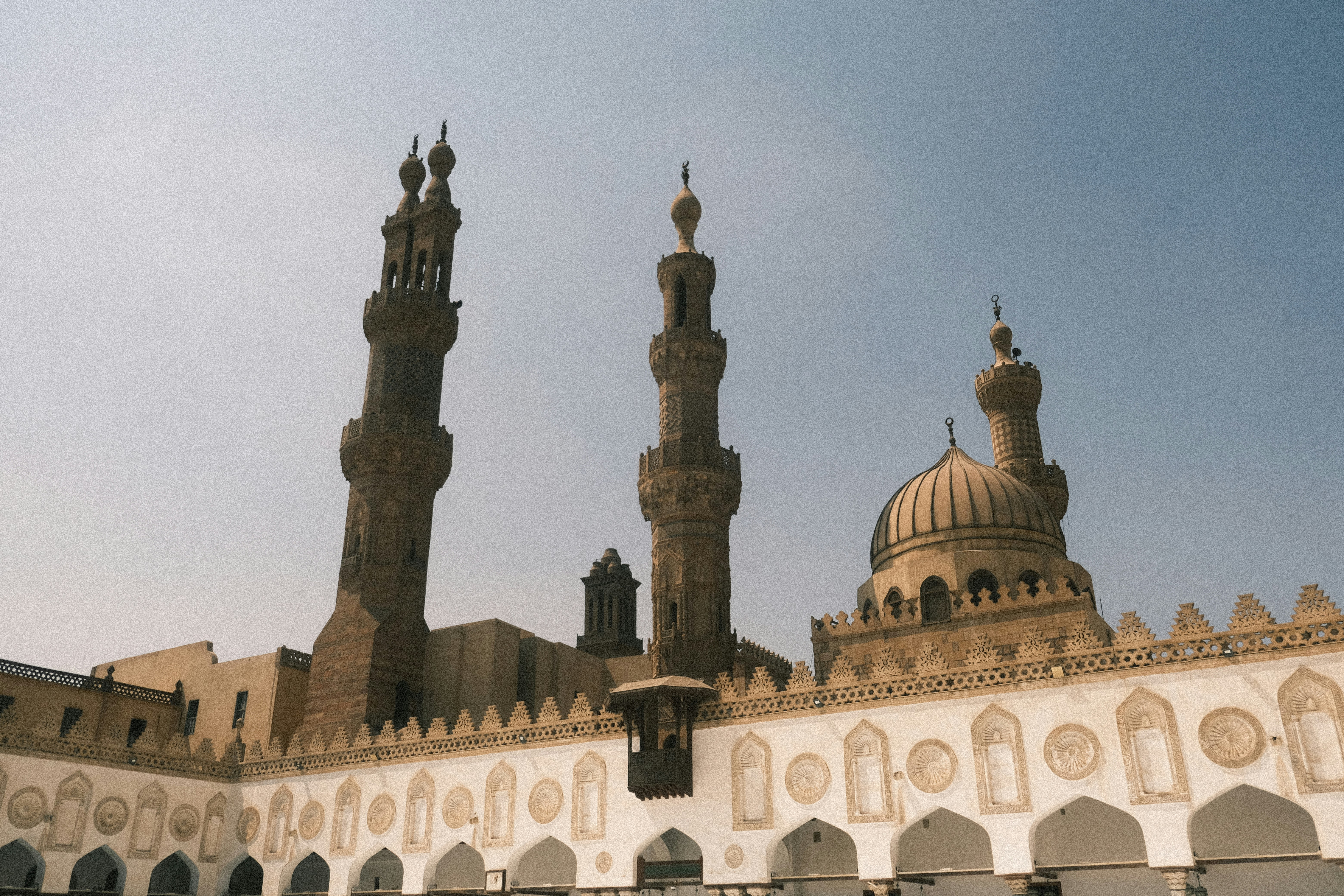 Ornate minarets and dome of an ancient mosque.
