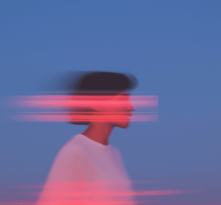 A woman is depicted with a pink light trail in front of her, adding a striking and colorful element to the scene.
