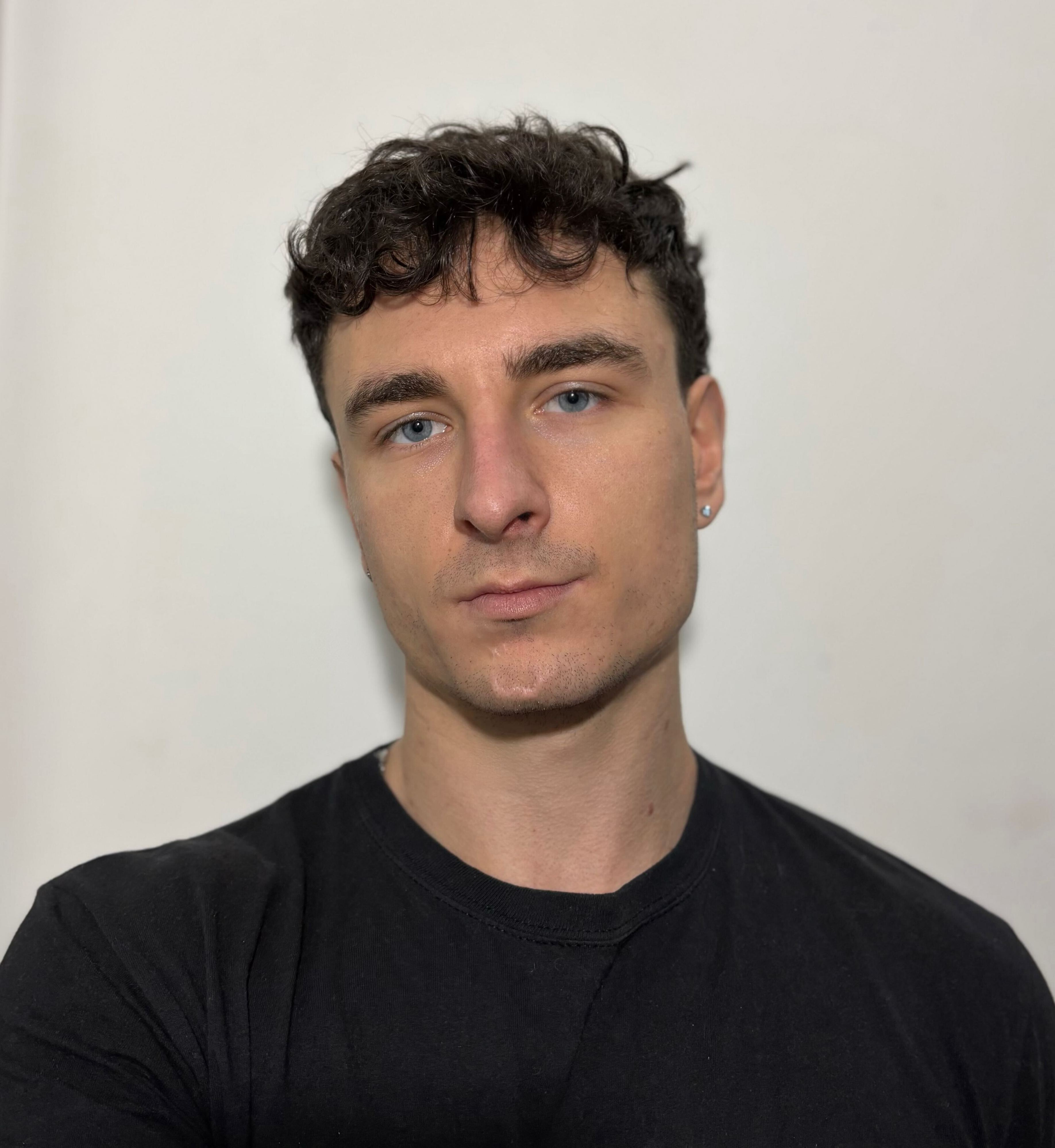 grayscale photography of man wearing crew-neck shirt